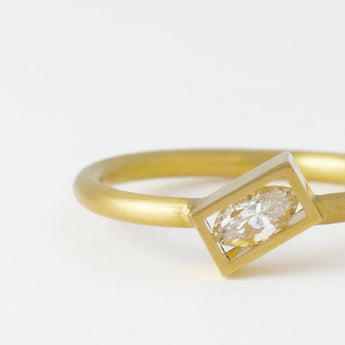 Position yellow gold rectangle frame marquis diamond ring