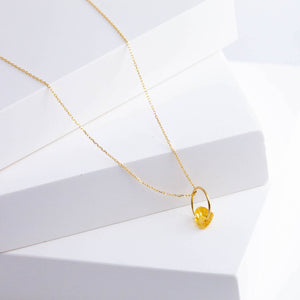 Rough stone gold grossular garnet pendant