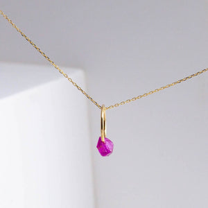 Rough stone ruby pendant