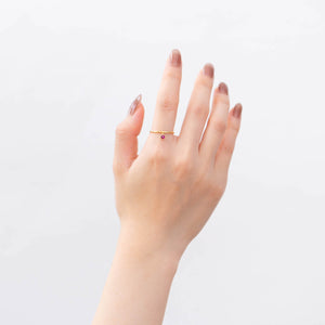 Swinging round ruby ring