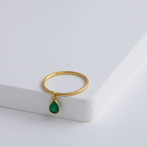 Swinging pear emerald ring