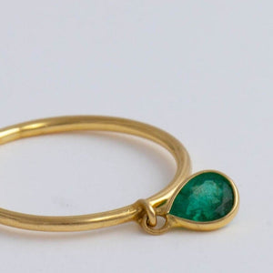 Swinging pear emerald ring