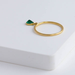 Swinging pear emerald ring