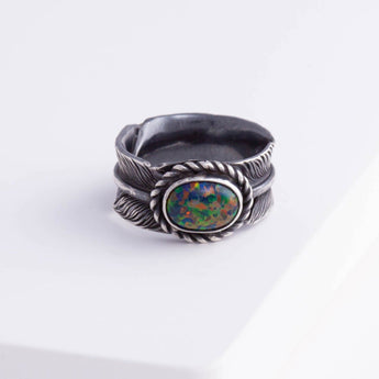 Oxidized silver large infinity feather ring with Kyocera opal